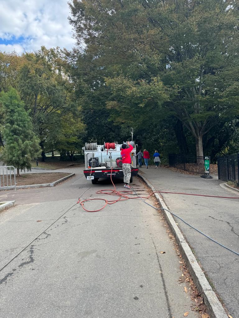 Pressure washing and parking lot striping services for a construction project.