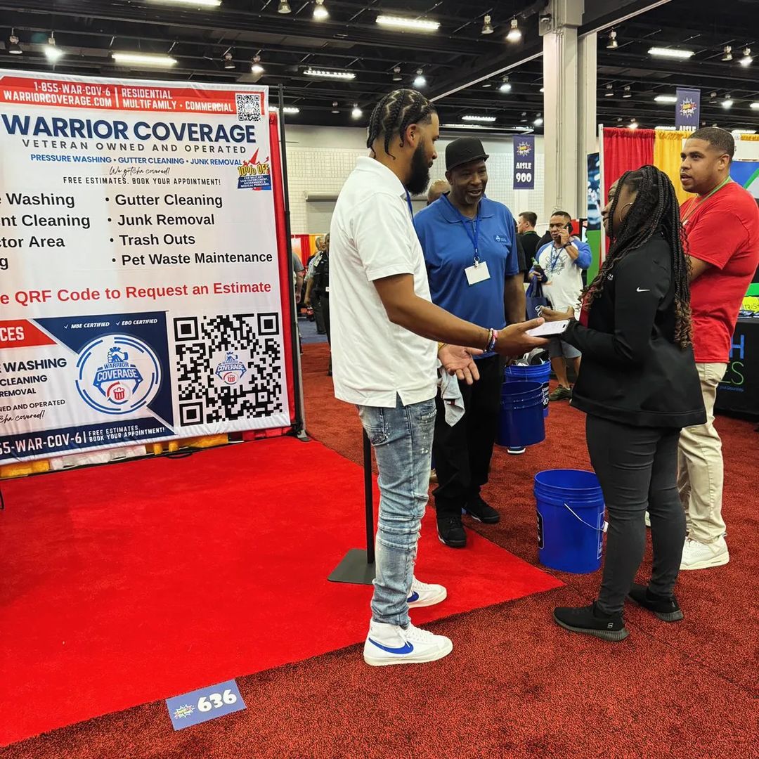 Brian, Director of Operations at Warrior Coverage, engaging with clients at the AAA Tradeshow 2024, discussing property maintenance solutions.