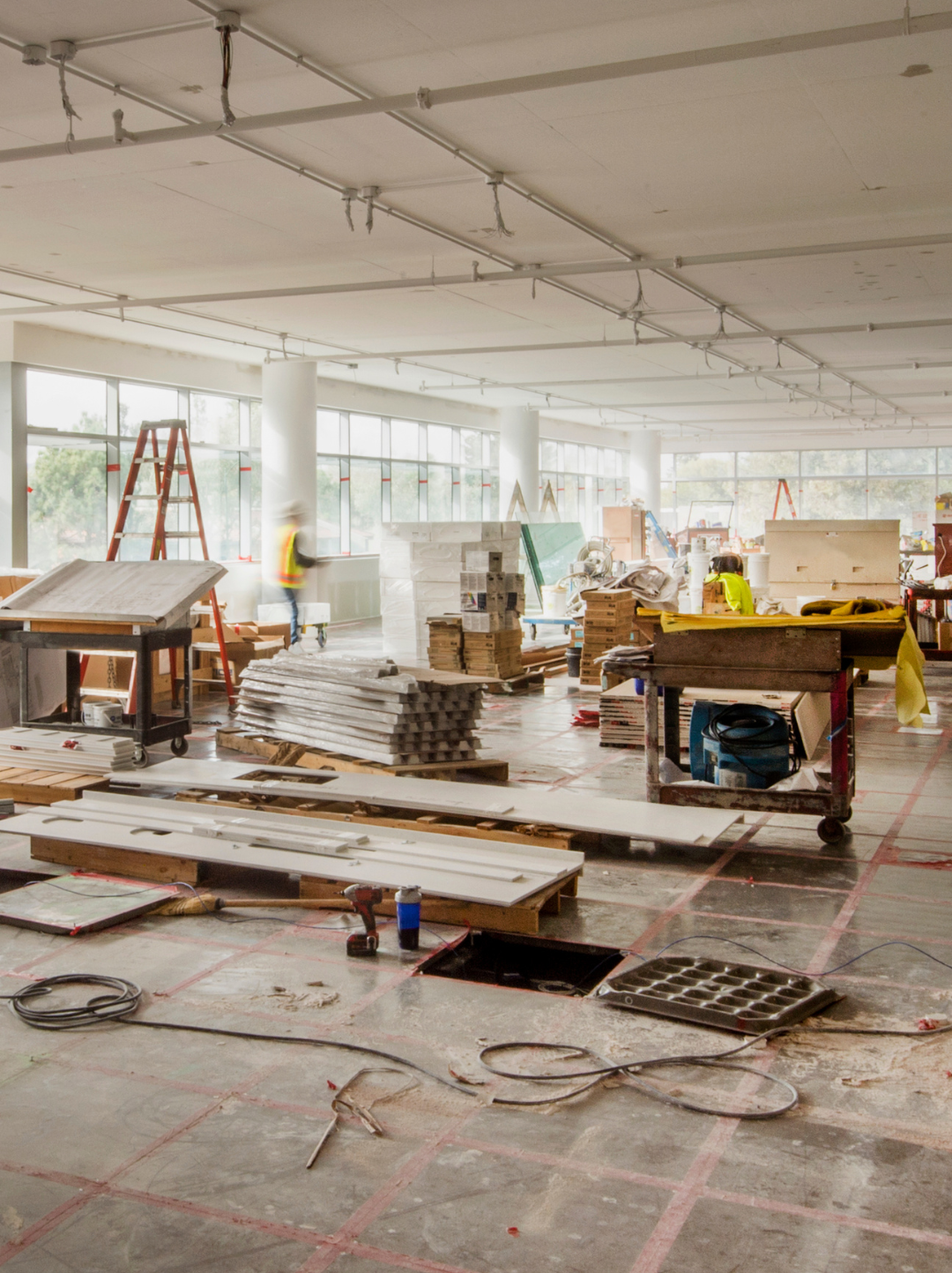 Warrior Coverage team performing post-construction cleanup at a commercial site.